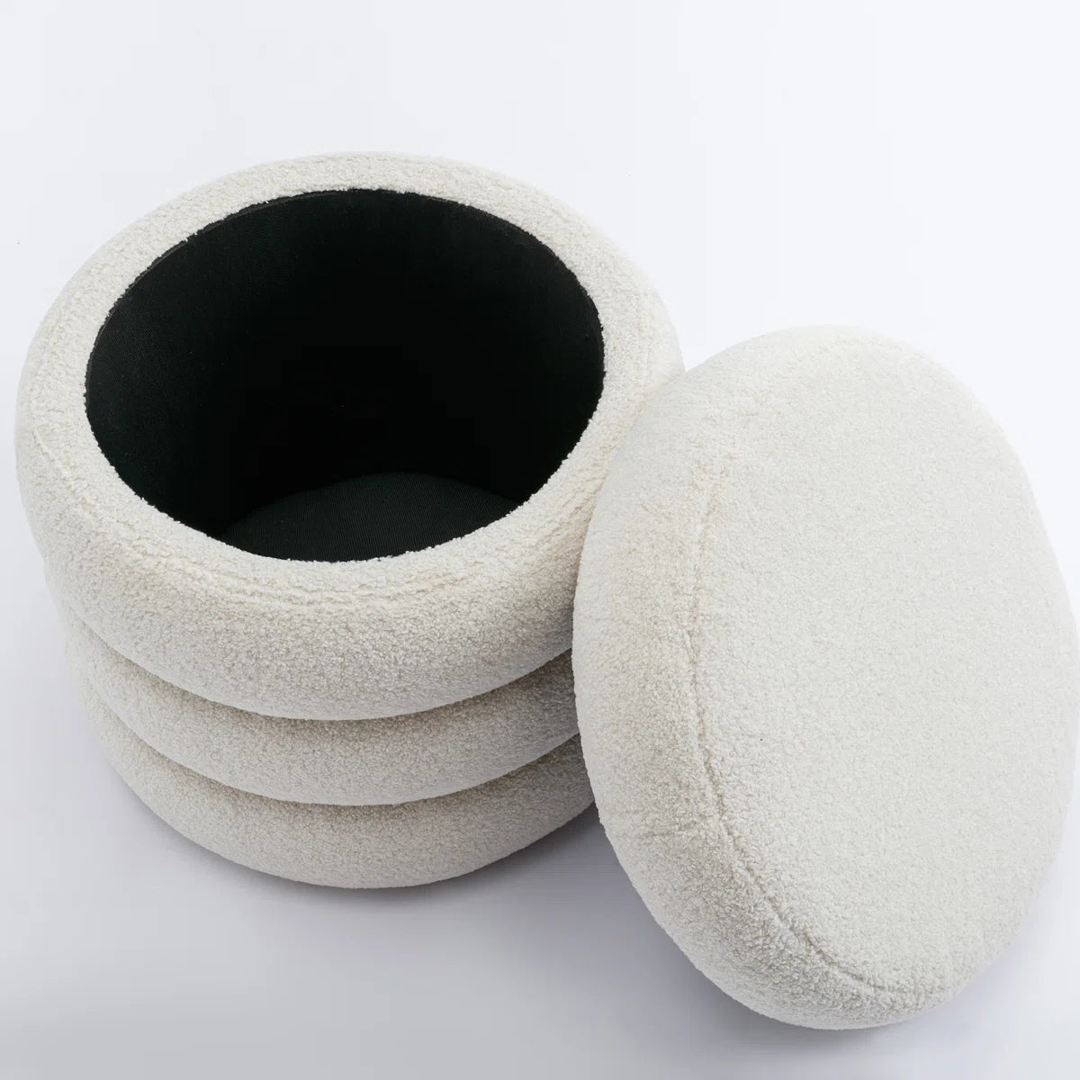Alvare™ | Ottomana redonda tapizada con almacenamiento
